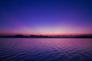 Purple light sky at sunset With scattering light on the marshes / wetland Nature in the northern region of Thailand.
