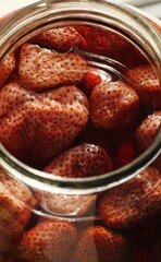 Delicious compote with strawberries in a jar
