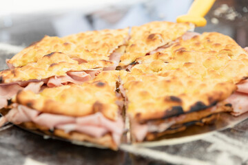 Italian cuisine: preparation of the white, with mozzarella and mortadella. Design serving. professional cook at work, use of hands. food photography for menus and websites