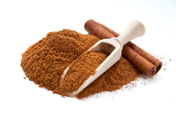 Cinnamon sticks and cinnamon powder in wooden scoop