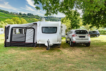 Caravan with car on campsite