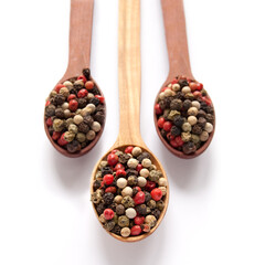 Colored peppercorn in the wooden spoon