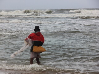 Fisherman fishing in Sea in Goa, India