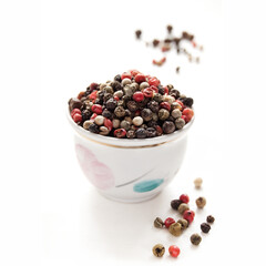 Peppercorn mix in bowl on the white background