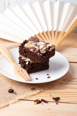 Close up. Brownies on a wooden background.