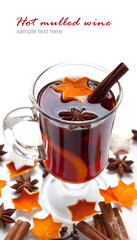 Hot red mulled wine isolated on white background with christmas spices
