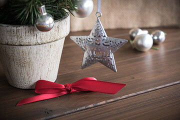 Christmas and a New Year background with a Christmas tree, red bow and a Christmas tree decorations