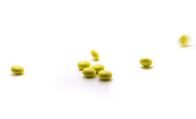 Lots of scattered and falling pills on white isolated background