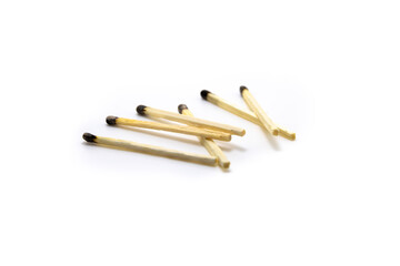 Pile of burnt matches on white isolated background