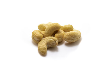Several cashew nuts on white isolated background macro photo