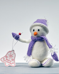 Christmas snowman made of wool. White background.