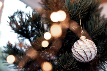 Christmas tree decoration
Christmas tree decoration with balls and golden bokeh. Close-up with...