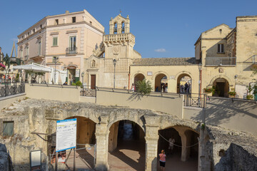 Fototapeta premium People walking on the old center of Matera on Italy