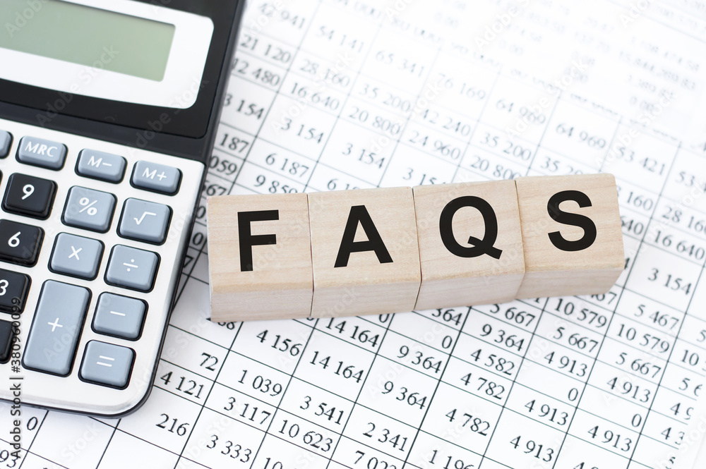 Poster concept of faqs word on wooden cubes lying on white background with calculator