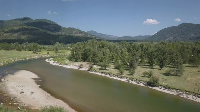 Drone View Over Small River Moving Forward