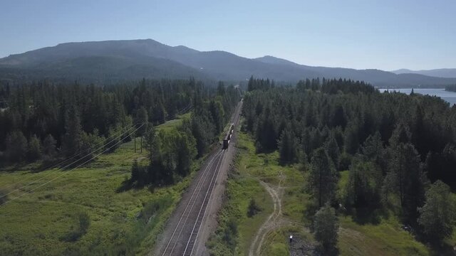 Aerial View of Drone Closing in on Train and Railcars
