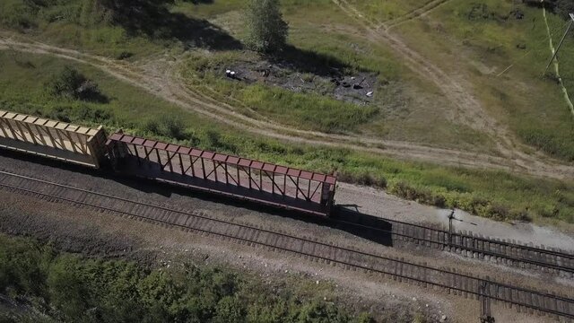 Aerial View Train Track Switchman and Centerbeam Railcars