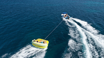 Aerial drone photo of extreme powerboat donut water-sports cruising in high speed in tropical exotic island bay
