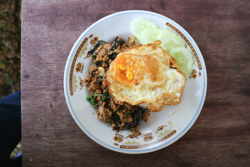  stir fried pork with chili paste, holy basil and fried egg