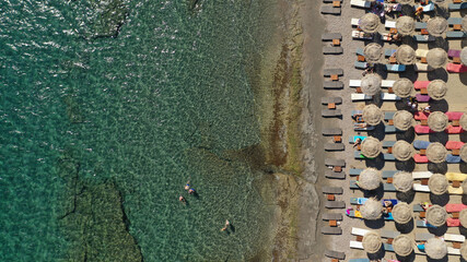 Aerial drone top down photo of organised crystal clear sea beach in Mediterranean popular destination