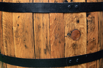 old oak barrel background Cover wine barrel, close-up.