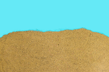 sand on blue background, summer concept