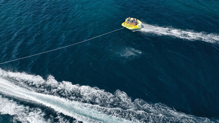 Naklejka premium Aerial drone photo of extreme powerboat donut water-sports cruising in high speed in tropical exotic island bay