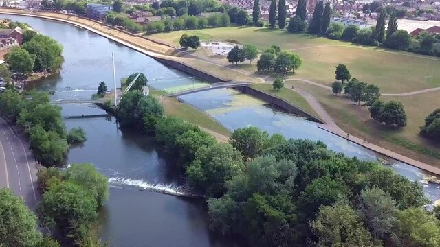 Aerial fly over of River Exe in Exeter, UK, on a summer day