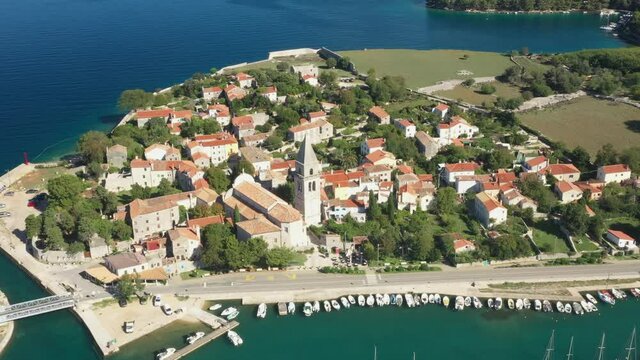 Historic town of Osor with bridge connecting islands Cres and Losinj, Croatia, aerial view from drone