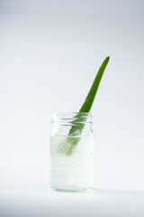 Slice aloe vera and gel on white background