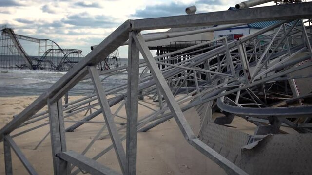 After Hurricane sandy the Seaside Heights boardwalk and pier are destroyed leaving its roller coasting sitting in the ocean.