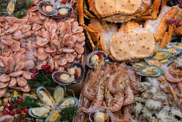 Seafood on ice at the fish market. Sea food background top view.