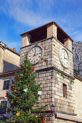 Fototapeta na wymiar Clock Tower in Old Town of Kotor on sunny winter day, Montenegro