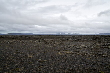 Vulcanic landscape in the highlands of iceland, black ash deserts with green moss