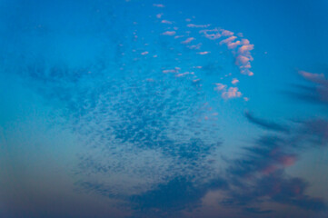 Blue bright sky with different beautiful clouds