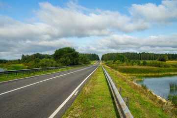 A beautiful automobile asphalt road without cars and people.