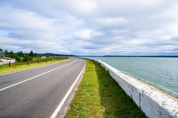 A beautiful automobile asphalt road without cars and people.