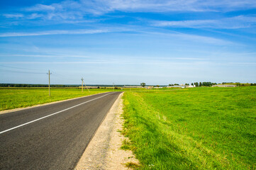 Fototapeta na wymiar A beautiful automobile asphalt road without cars and people.