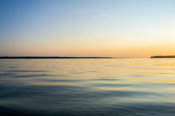 Fototapeta na wymiar Beautiful lake landscape with sunset near the water