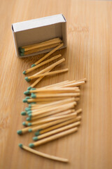 Box of matches on wooden background close up