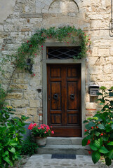 Fototapeta na wymiar Shaded doorway in Passignano Chianti Tuscany Italy