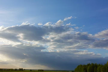 Foto op Canvas Blue sky with clouds and sun. © Aleksandr