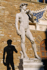 Statue of David by Michelangelo and his shadow in Signoria Square Florence