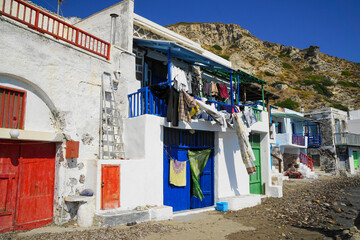 Fototapeta na wymiar Fishing village with clothes hanging to dry in Milos, Greece