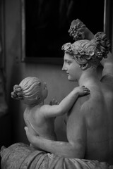 Close up. The white marble  Renaissance sculptures of a woman & a child created by the Italian artist Michelangelo at Galleria dell'Accademia. The art subjects in Florence, Tuscany, Italy. Europe.