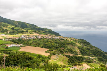 View of the city with farms in the mountains near the sea, Sao Miguel - Azores