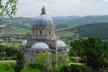Fototapeta na wymiar Santa Maria della Consolazione with Umbrian landscape in todi Italy