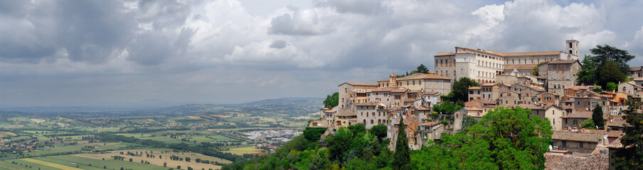 Fototapeta na wymiar Panorama of hilltop city of Todi Italy with Tiber valley farm fields and Pontecuti