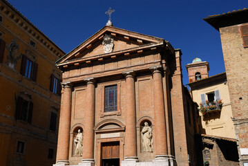 Fototapeta na wymiar Saint Christopher church and bell tower in Siena Tuscany Italy