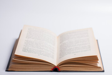 Photo of an open book on a white background.
